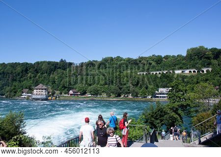 Neuhausen Am Rheinfall, Switherland - May 26, 2022: Tourists At Rheinfall Observation Deck On May 26
