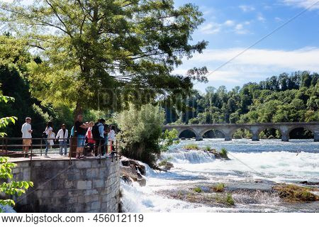 Neuhausen Am Rheinfall, Switherland - May 26, 2022: Tourists At Rheinfall Observation Deck On May 26