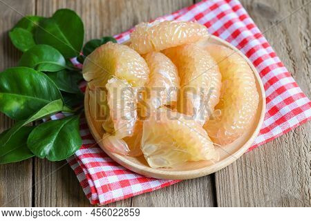 Pomelo Fruit On Wooden Plate, Fresh Green Pomelo Peeled On Wooden And Green Leaf Frome Pomelo Tree ,