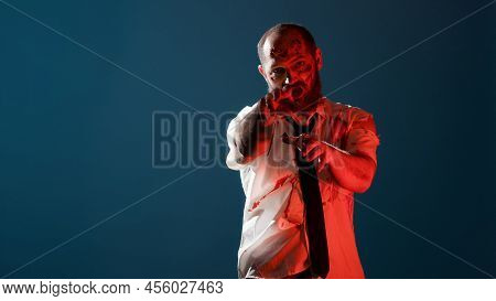Bizarre Looking Brain-eating Zombie Growling On Flashing Red Light While Standing On Blue Background