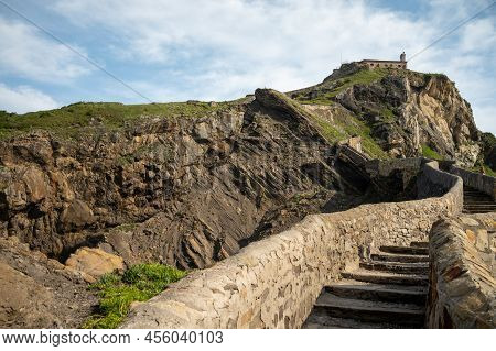 Stone Footpath To Famous Landmark And Film Location In North Of Spain, Ocean Islet With Chapel San J