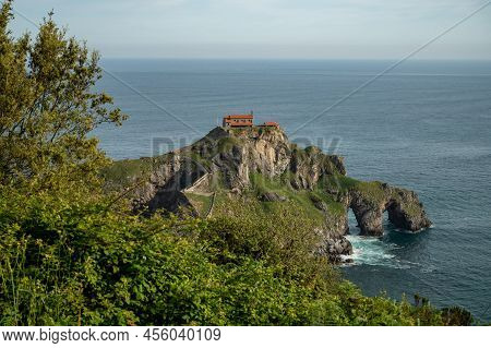 Stone Footpath To Famous Landmark And Film Location In North Of Spain, Ocean Islet With Chapel San J