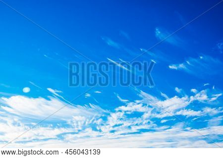 White Spindrift Clouds Moving Fast In Light Blue Sky. Cloudscape. Nature Background. Windy Weather F