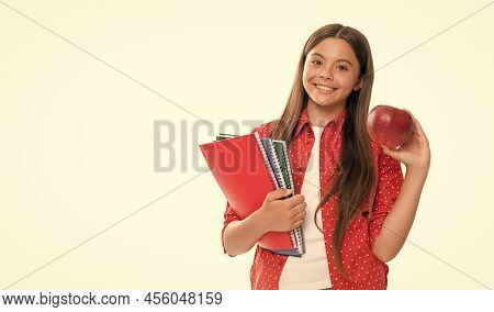 Happy Child Hold School Copybook For Studying And Apple Lunch Isolated On White, School Lunch