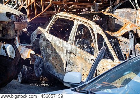 The Car Burned Down Completely, Even The Tires Burned Out. Burnt Out Car Crash After Fire. The Bomb
