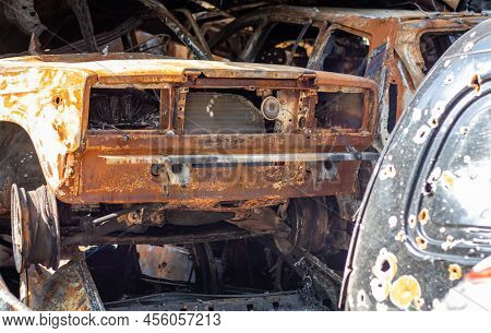 The Car Burned Down Completely, Even The Tires Burned Out. Burnt Out Car Crash After Fire. The Bomb