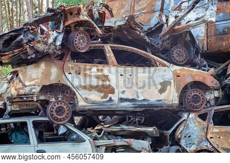Russian Invasion Of Ukraine In 2022, Destroyed And Burned Cars. Cars Were Beaten With Shrapnel And B