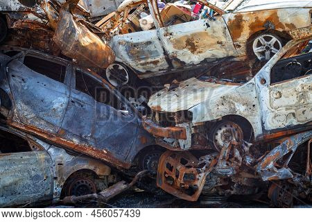Russian Invasion Of Ukraine In 2022, Destroyed And Burned Cars. Cars Were Beaten With Shrapnel And B