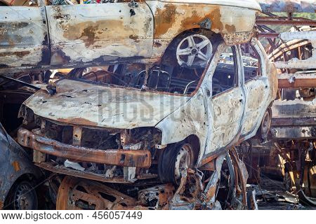 Russian Invasion Of Ukraine In 2022, Destroyed And Burned Cars. Cars Were Beaten With Shrapnel And B