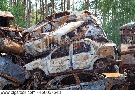 Russian Invasion Of Ukraine In 2022, Destroyed And Burned Cars. Cars Were Beaten With Shrapnel And B