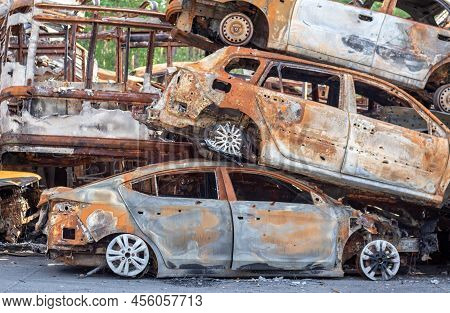 A View Of Burnt-out Cars After Rocket Attacks By The Russian Military. War Of Russia Against Ukraine