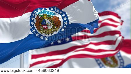 The Missouri State Flag Waving Along With The National Flag Of The United States Of America. In The 