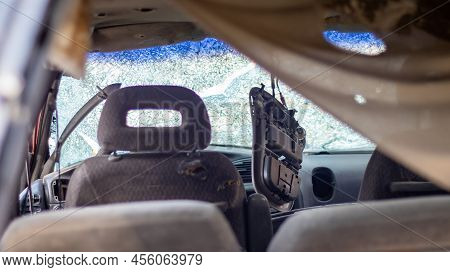 Close-up Of A Car With A Broken Windshield After A Fatal Crash. Consequence Of A Fatal Car Accident.