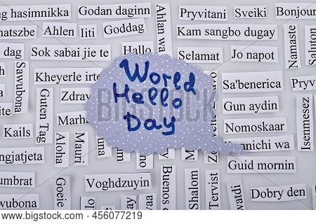 World Hellow Day Concept. Paper Pieces On White Background. Top View Flat Lay.
