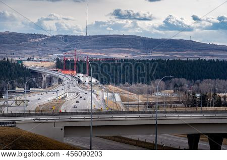Calgary Alberta Canada, June O1 2022: The Stoney Trail Bridge Under Construction Over The Bow River.