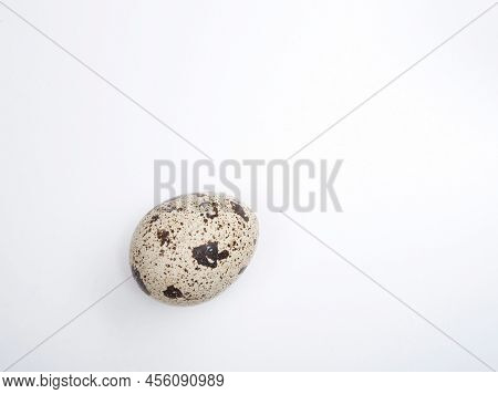 One Quail Egg With A Lot Of Imperfect Dark Spots On A Smooth, Ideal Oval Surface Of A Healthy Non Ch