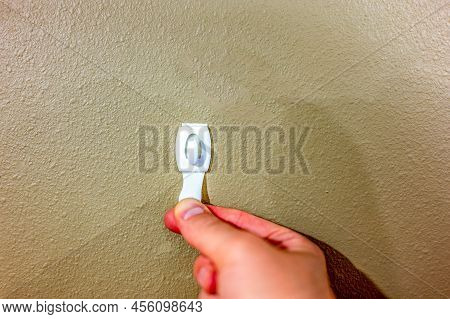 Selective Focus On Adhesive Strip Wall Hanger That Can Be Removed By Pulling Tape