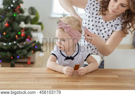 Mother Fixing Her Daughters Cochlear Implant Hearing Aid - Deafness And Diversity Concept. Innovativ