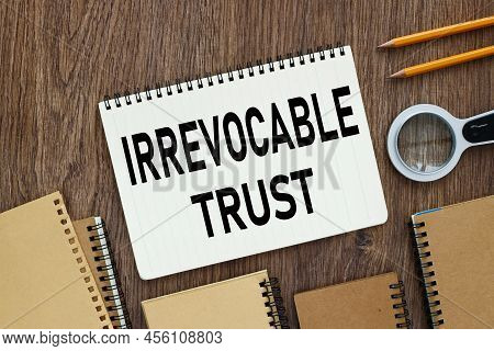 Irrevocable Trust Document With Text On Wooden Background