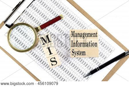 Mis Text On Wooden Block On A Chart Background