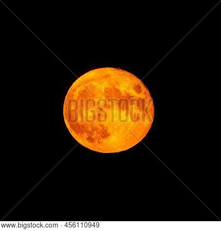 Bright Orange And Red Fool Moon Over The Sea. Red Full Moon In Red Color Also Called Bloodmoon
