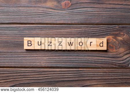 Buzzword Word Written On Wood Block. Buzzword Text On Cement Table For Your Desing, Concept.