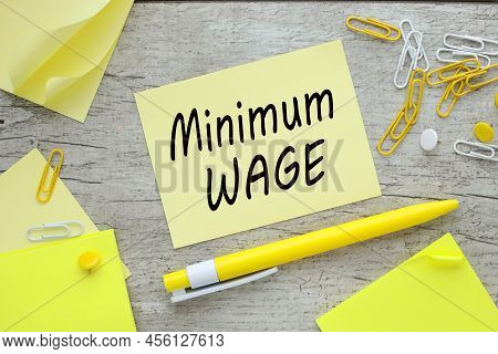 Minimum Wage On Paper Sticker Near Paperclips