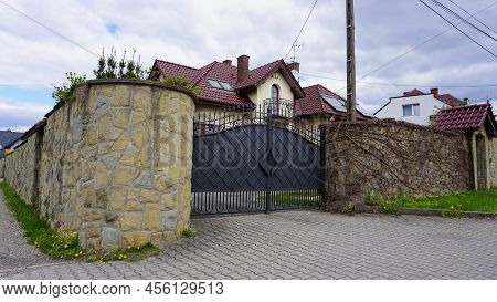 Residential Neighborhood Of Wroclaw. Small Simple Two Storey Detached House With Pitched Roof, Stone