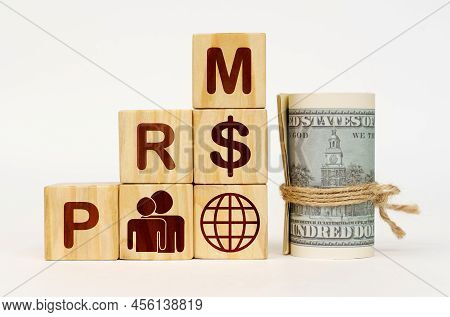 Business Concept. On A White Surface, Dollars And Cubes With Images And The Inscription - Prm