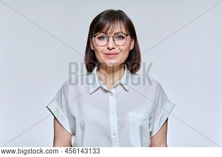 Headshot Portrait Of Smiling Middle Aged Woman Looking At Camera