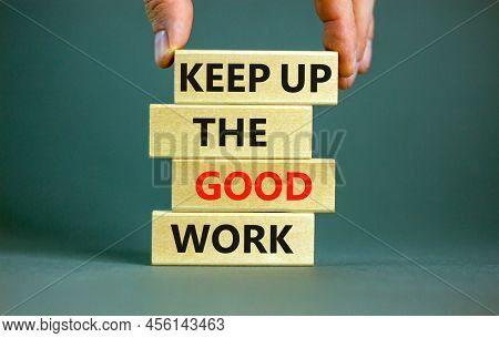 Keep Up The Good Work Symbol. Concept Words Keep Up The Good Work On Wooden Blocks. Businessman Hand