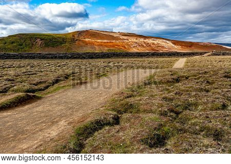 Beautiful Colourful Icelandic Landscape Lava Fields Mountain Geysers Zigzag Road And Moss-covered St