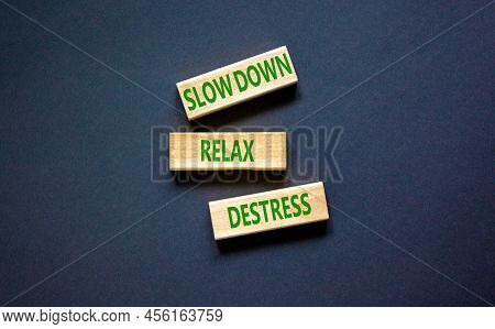 Destress Symbol. Concept Words Slow Down Relax Destress On Wooden Blocks. Beautiful Black Table Blac
