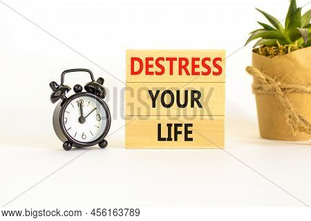 Destress Your Life Symbol. Concept Words Destress Your Life On Wooden Blocks. Black Alarm Clock. Bea