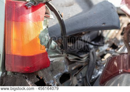 A Red And Orange Broken Glass Lamp On A Car As A Result Of A Violent Collision. Broken Rear Headligh