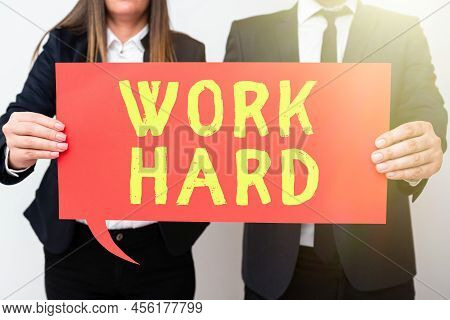 Text Sign Showing Work Hard. Business Approach Laboring That Puts Effort Into Doing And Completing T
