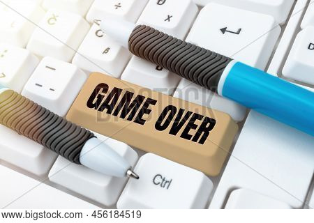 Hand Writing Sign Game Over. Internet Concept A Situation In A Particular Sport That Reach His Final