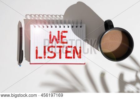 Handwriting Text We Listen. Word Written On Group Of Showing That Is Willing To Hear Anything You Wa