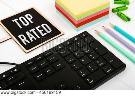 Hand Writing Sign Top Rated. Internet Concept The High Amount Of A Charge Or Payment Based On Calcul