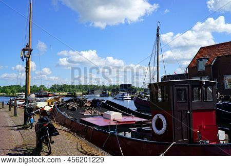 Pituresque Picture Of The Old Port Of Spakenburg. Old Fishing Boats, Bicycles, A Lamppost. Everythin