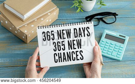 365 New Day, 365 New Chance Written In A Notebook In Hands. Concept Business And Finance.