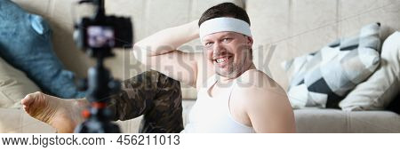 Portrait Of Middle Aged Man Record Video Classes Of Doing Sports On Videocamera. Active Man In Sport