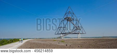 Bottrop, Germany - May 09, 2022: Panorama Of A Young Couple Walking To The Tetrahedron In Bottrop, G