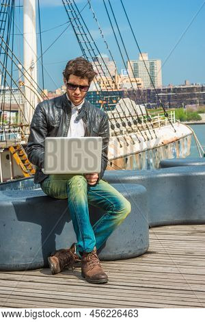 European Businessman Traveling, Working In New York. Wearing Black Leather Jacket, Blue Jeans, Brown