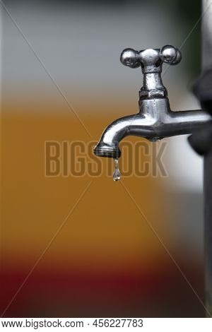 Faucet Dripping Water Drop