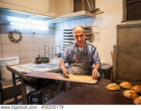 Istanbul, Turkey - May 21, 2022: Selective Blur On A Senior Man, A Pideci, A Baker, Preparing A Doug