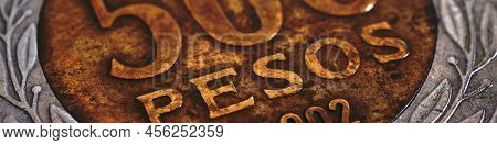 Translation: 500 Pesos. Coin Of 500 Chilean Pesos Close-up. Peso Of Chile. News About Economy Or Ban