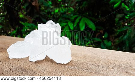 White Clear Alum Cubes On Brown Woodplank Concept For Beauty And Medical Industrial.