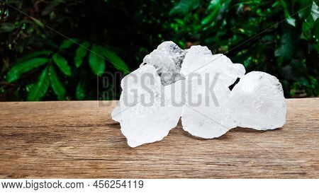 White Clear Alum Cubes On Brown Woodplank Concept For Beauty And Medical Industrial.