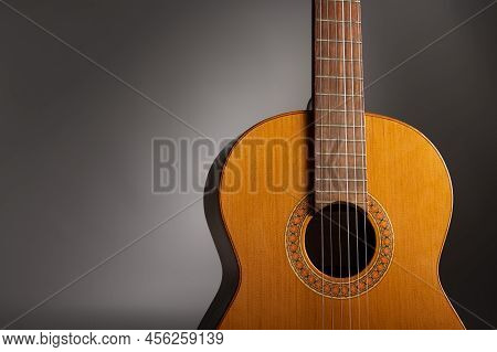 Classical Guitar On Grey Background With Copy Space